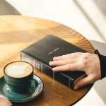 Close-up, a man reads the Bible in the morning.